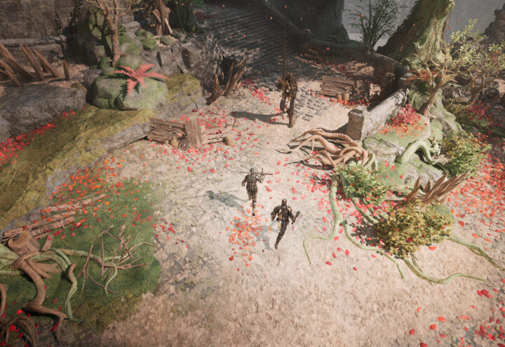 Capture d'écran du jeu Wardens of Avalon. Une vue du dessus. Il s'agit d'un joli chemin entouré de racines et d'arbres. Des petits coins d'herbes l'entourent. Beaucoup de pétales rouges recouvrent le sol à certains endroits. Une lumière naturelle légère mais tout de même vive illumine l'endroit. Des chevaliers courent sur le chemin, prêt à attaquer un ennemi.